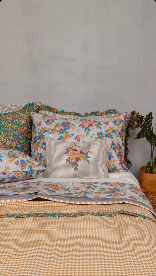 Amazônia Collection bedding review featuring colorful floral print pillows and bedspread with nature-inspired design