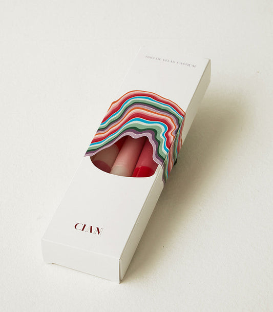 Cian Candle packaging featuring colorful design holding rainbow decorative candles in a white box
